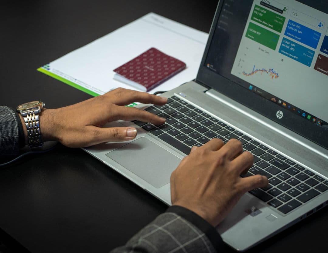 Marketing analyst reviewing AI search visibility data on a laptop